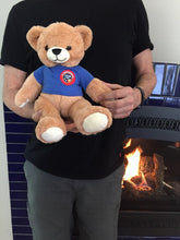Man holding the Family and Business Listening Bear to show its relative size.
